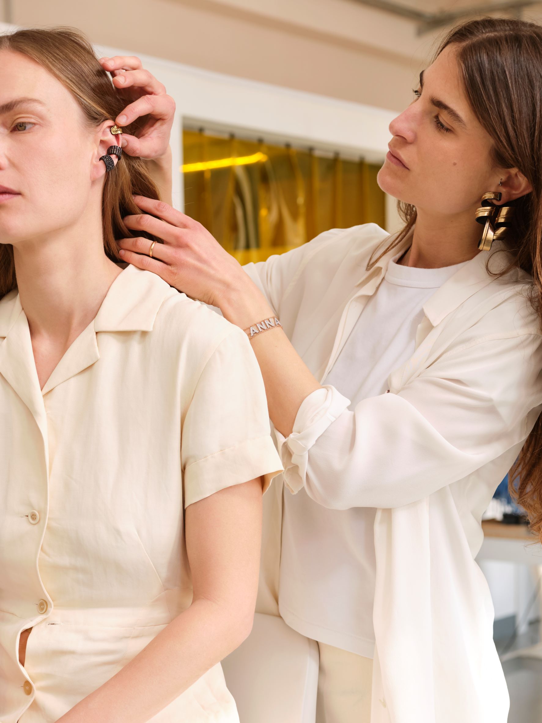 Model wears Luce Gold Rain Ear Cuff in Leather and Maria Sole Ferragamo wears the Nastro Earrings in Silver Leather. Image Courtesy of So-Le Studio