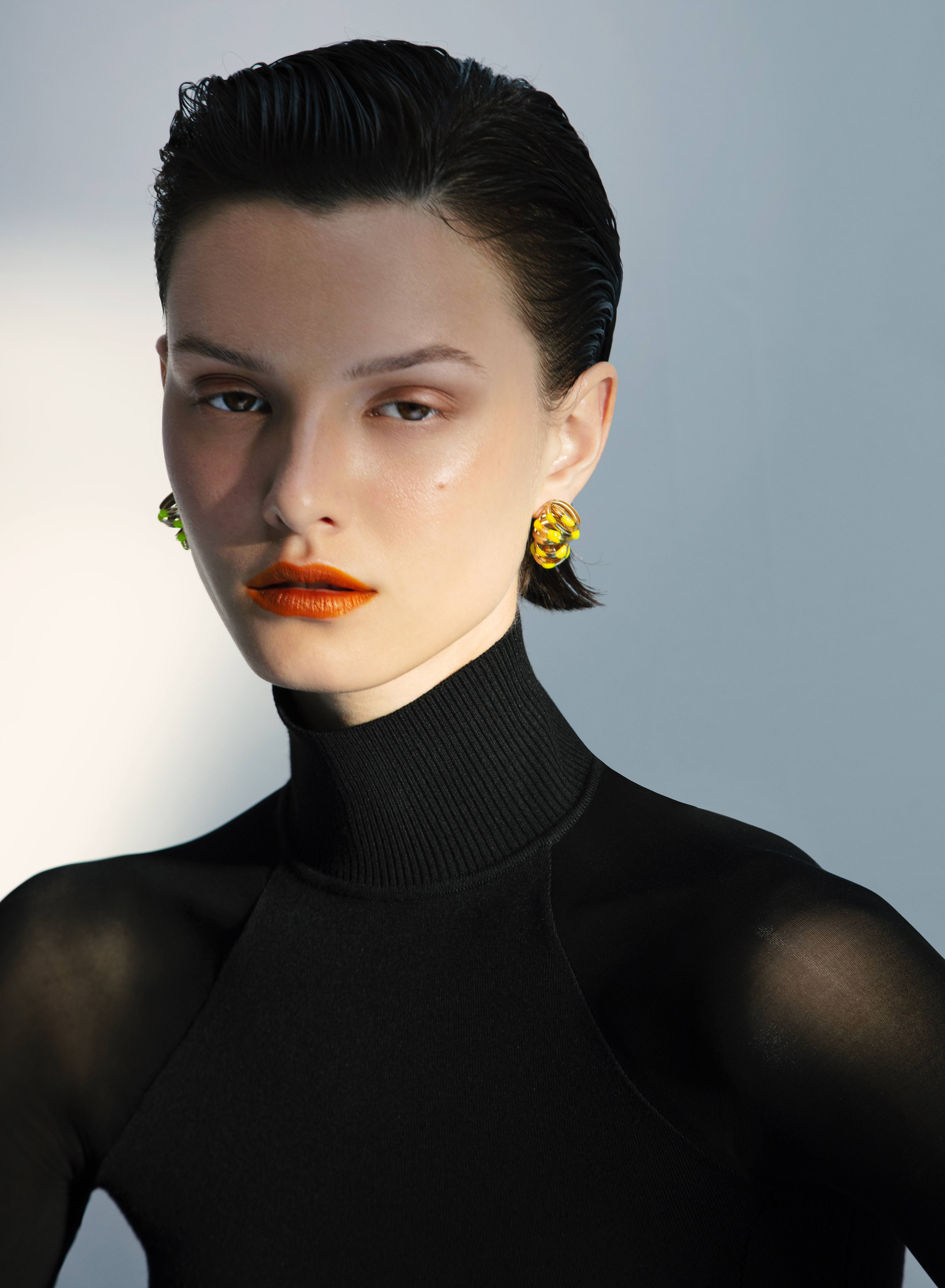 Cocoon Ear clips in gold coated brass and yellow enamel. Image Courtesy of So-Le Studio