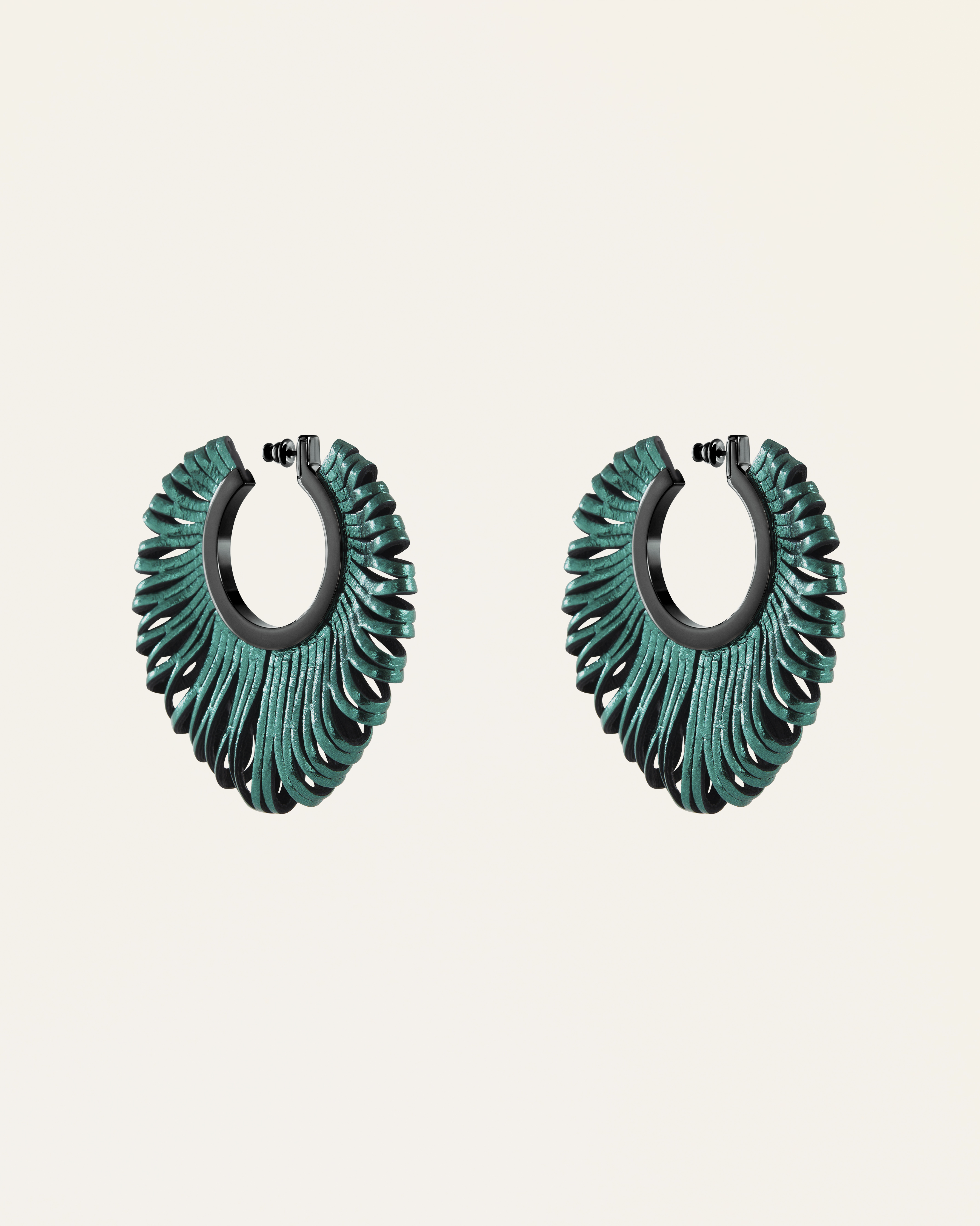 Revolve Earrings in Petrol Green Leather. Image Courtesy of So-Le Studio